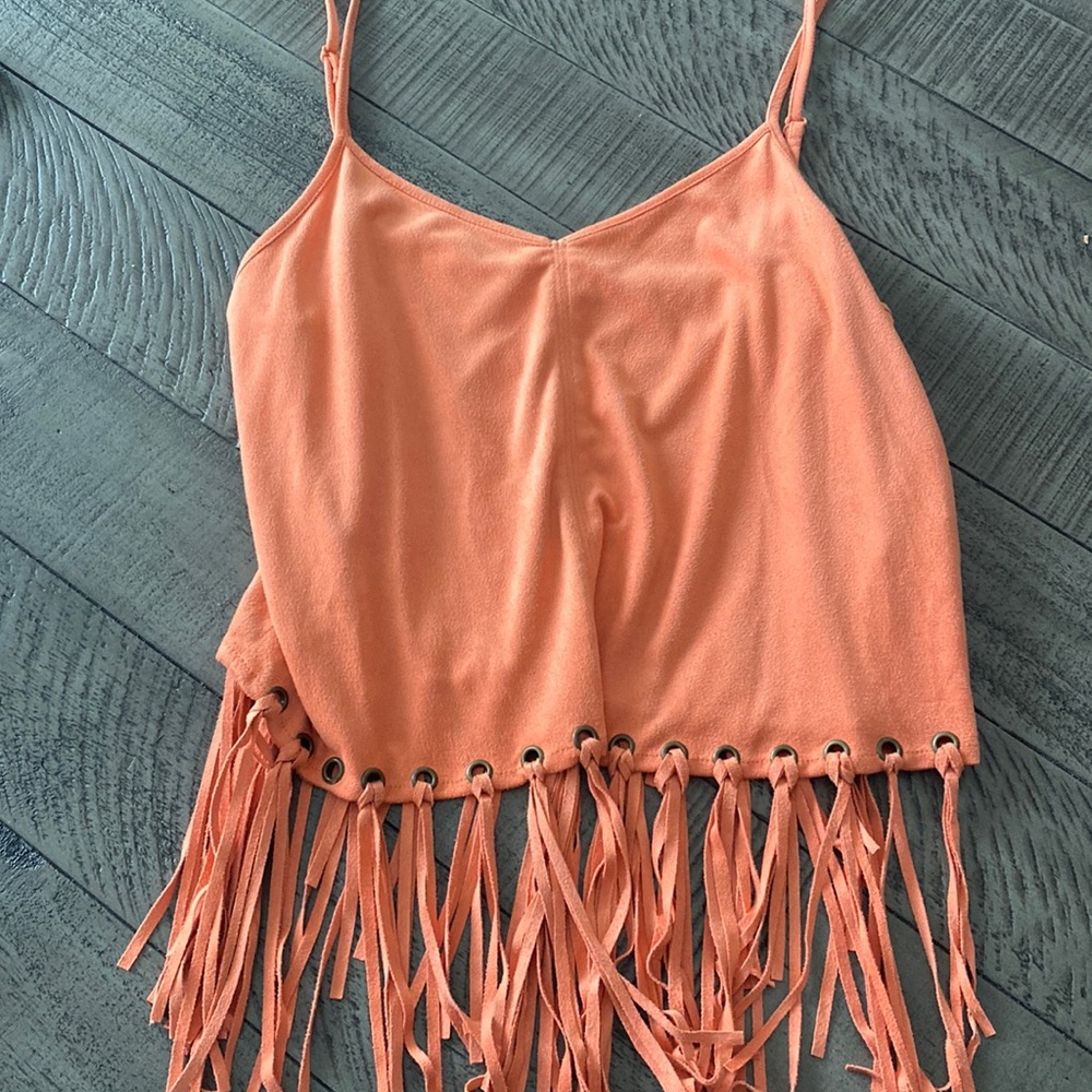 Orange faux suede top with fringe